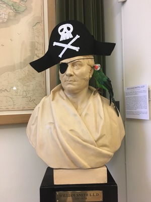 Captain Strata Smith and his parrot welcome treasure hunters to the Geological Society